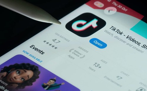 Dhaka, Bangladesh- 30 Oct 2025: TikTok app on a iPad screen with a pen pointing at the install