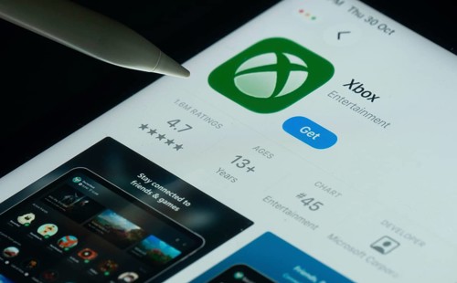 Dhaka, Bangladesh- 30 Oct 2025: Xbox app on a iPad screen with a pen pointing at the install option