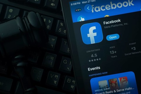 Dhaka, Bangladesh- 28 Oct 2025: An iPad displaying the Facebook app against a judge's gavel and
