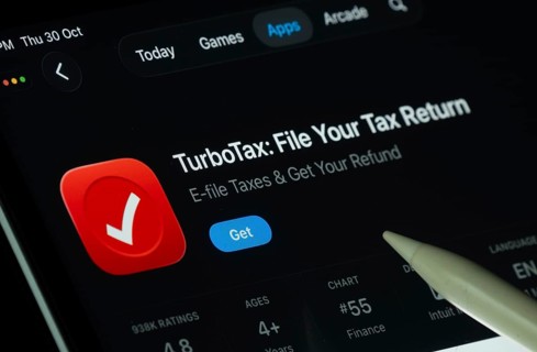 Dhaka, Bangladesh- 30 Oct 2025: TurboTax app displayed on a iPad screen in dark mode with a digital