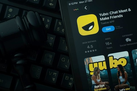 Dhaka, Bangladesh- 28 Oct 2025: An iPad displaying the Yubo app against a judge's gavel and dark