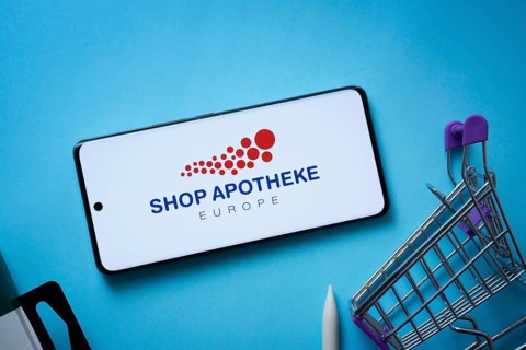 Dhaka, Bangladesh- 03 July 2025: Smartphone displaying (...) logo with shopping cart on a blue