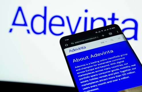 Dhaka, Bangladesh- 03 July 2025: Smartphone displaying Adevinta web interface against Adevinta logo