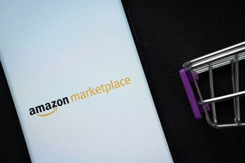 Dhaka, Bangladesh- 21 Nov 2025: A smartphone displaying the amazon marketplace logo next to a