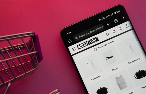 Dhaka, Bangladesh- 21 Nov 2025: A smartphone displaying the About You website with a shopping cart