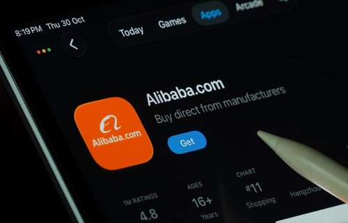 Dhaka, Bangladesh- 21 Nov 2025: Alibaba.com app displayed on a iPad screen in dark mode with a