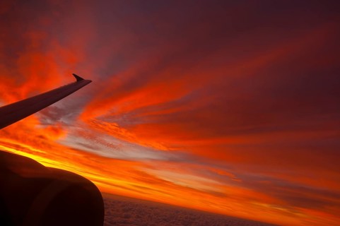 View from airplane window at sunrise