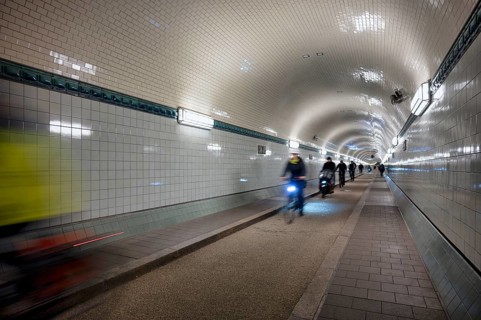 Interior view, pedestrians and cyclists crossing tunnel, mopping effect, movement, tube, historic