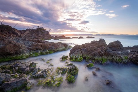 Sunset at Fisherman's Lookout. Dramatic waves and coastal scenery at The Pass, New South Wales,