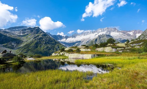 Picturesque mountain landscape, dammastock and damma glaciers reflected in Moorsee, Göscheneralp,
