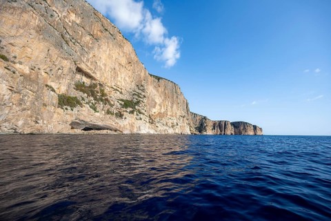 Picturesque rocky coast, cliffs and blue sea, Golfo di Orosei, Baunei, Sardinia, Italy