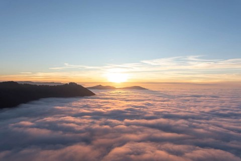 Sunset over the sea of fog from Beurener Fels to Hohenneuffen Castle, Swabian Alb,