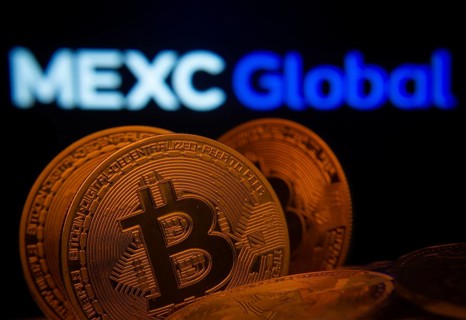 Dhaka, Bangladesh- 03 Sep 2025: Close-up of Bitcoin coins with the MEXC Global logo visible on a