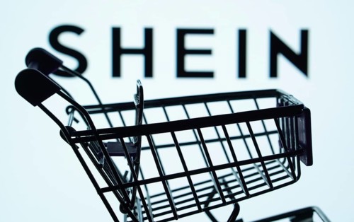 Dhaka, Bangladesh- 03 July 2025: Silhouette of a shopping cart in front of the SHEIN logo,