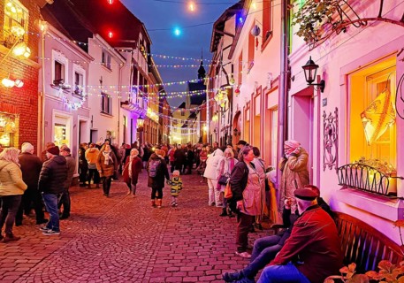 People in the Tiefstraße decorated for the Martin train in the evening, historic old town, Kempen,