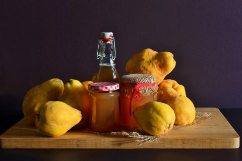 Still life with quinces, homemade quince jelly and quince liqueur, autumn, Germany