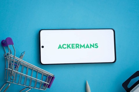 Dhaka, Bangladesh- 03 July 2025: Smartphone displaying Ackermans logo with shopping cart on a blue