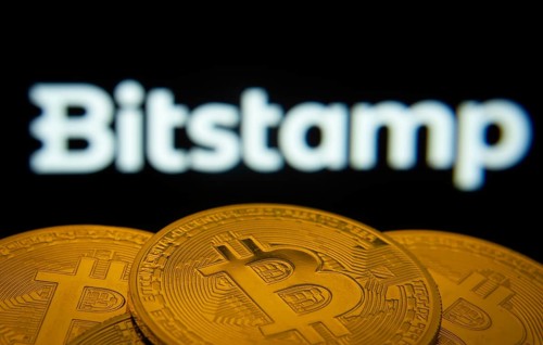 Dhaka, Bangladesh- 03 Sep 2025: Close-up of Bitcoin coins with the Bitstamp logo visible on a