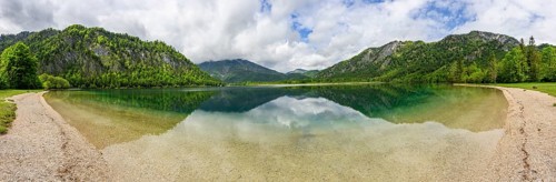Landscape of Lake Offensee after rain when the sun comes through the clouds in spring,