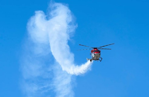 Indian Air Force aerobatic team performs during rehearsals ahead of the air show organised as part