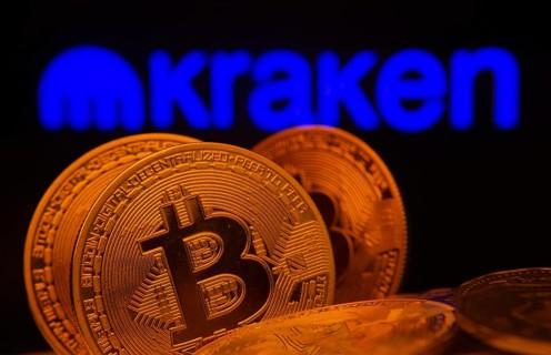 Dhaka, Bangladesh- 01 Nov 2025: Close-up of Bitcoin coins with the Kraken logo visible on a screen