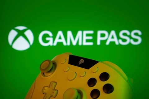 Dhaka, Bangladesh- 01 Nov 2025: A close-up of a gamepad with the Xbox Game Pass seen on screen in