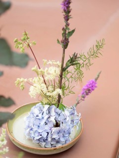 Floral arrangement made with hydrangea, meadowsweet and purple loosestrife during an ikebana