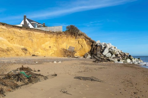 Clifftop houses at risk from coastal erosion, Thorpeness, Suffolk, North Sea coast, England, UK
