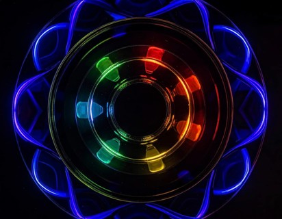 Abstract background of slightly unfocused multicolored glass lenses spinning and rotating,