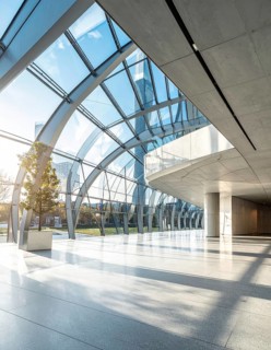 Modern architectural framework with glass and steel structure, glass facade with a greed of steel