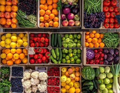 Fresh fruits and vegetables in a market display, aerial view perpendicular top down, healthy eating