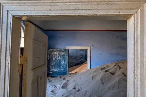 Former dwelling house full of sand, Kolmanskop, restricted diamond area, Karas region, Namibia