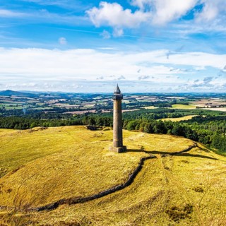 Waterloo Monument over Scottish fields and farms from a drone, Jedburgh, Scotland, UK