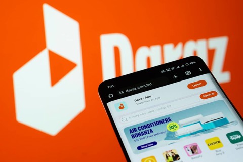 Dhaka, Bangladesh- 03 Oct 2025: Smartphone displaying Daraz web interface against Daraz logo