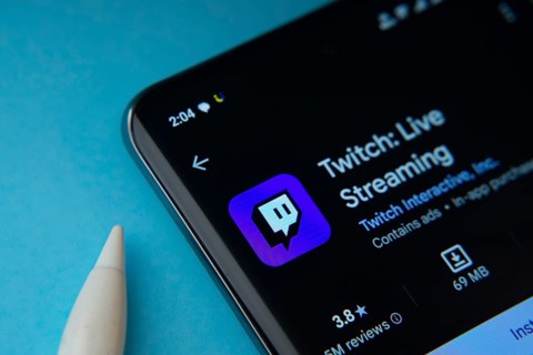 Dhaka, Bangladesh- 30 Sep 2025: On a blue surface, a smartphone displays the Twitch app within the