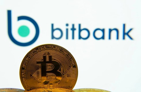 Dhaka, Bangladesh- 02 June 2025: Close-up of Bitcoin coins with the bitbank logo visible on a