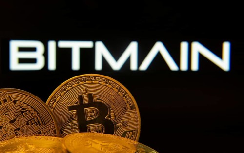 Dhaka, Bangladesh- 15 June 2025: Close-up of Bitcoin coins with the Bitmain logo visible on a