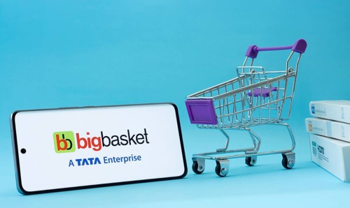 Dhaka, Bangladesh- 03 July 2025: Smartphone with BigBasket logo next to a small shopping cart and