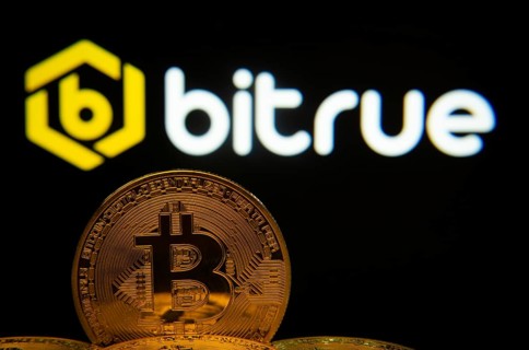 Dhaka, Bangladesh- 03 Sep 2025: Close-up of Bitcoin coins with the Bitrue logo visible on a screen