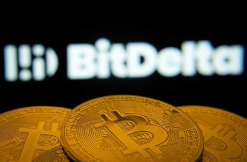 Dhaka, Bangladesh- 02 June 2025: Close-up of Bitcoin coins with the BitDelta logo visible on a