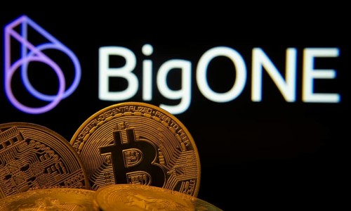 Dhaka, Bangladesh- 15 June 2025: Close-up of Bitcoin coins with the Bigone logo visible on a screen