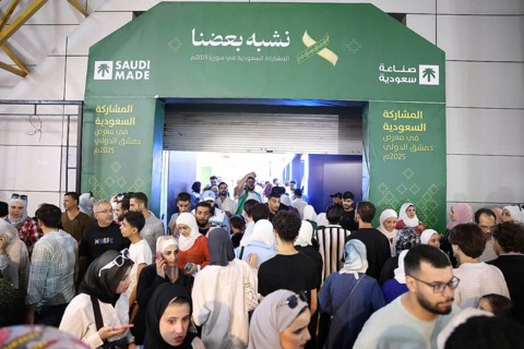 Saudi companies showcase products and investments inside the Saudi pavilion at the Damascus