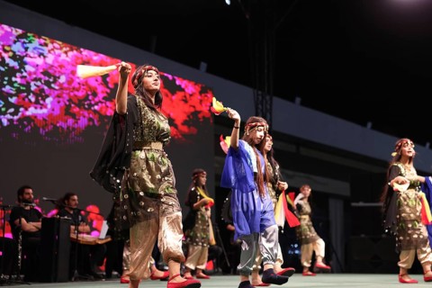 A Kurdish traditional dance troupe performs during the Damascus International Fair, the first