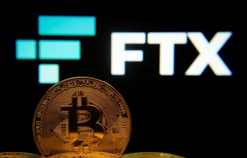 Dhaka, Bangladesh- 03 Sep 2025: Close-up of Bitcoin coins with the FTX logo visible on a screen in