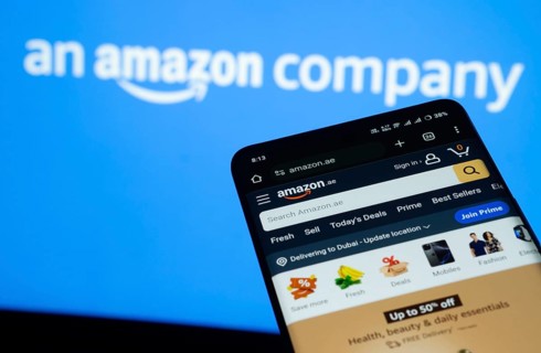 Dhaka, Bangladesh- 03 July 2025: Smartphone displaying Amazon web interface against Amazon logo