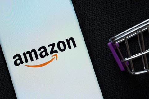 Dhaka, Bangladesh- 03 July 2025: A smartphone displaying the Amazon logo next to a miniature