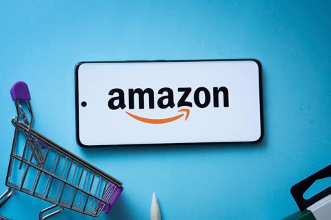 Dhaka, Bangladesh- 03 July 2025: Smartphone displaying Amazon logo with shopping cart on a blue