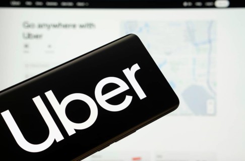 Dhaka, Bangladesh - 18 March 2025: The logo of the Uber is displayed on a smartphone screen, and