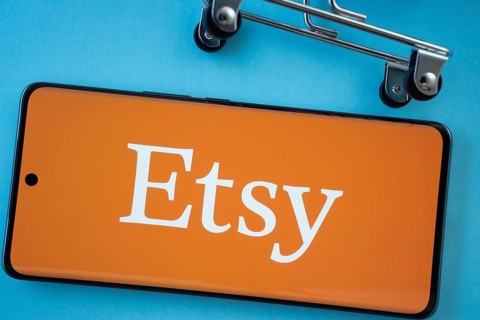 Dhaka, Bangladesh- 03 July 2025: Smartphone screen showing the Etsy logo with shopping cart wheels