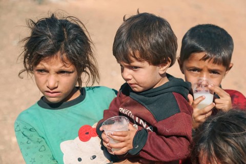 Syrian children playing in a refugee camp near the Turkish border on World Children's Day. Aleppo,